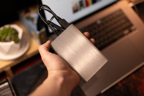 Hand holding a hard drive